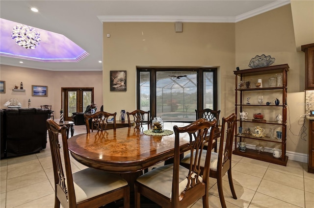 tiled dining space featuring french doors and ornamental molding