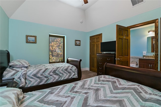 bedroom with ceiling fan, carpet floors, and lofted ceiling