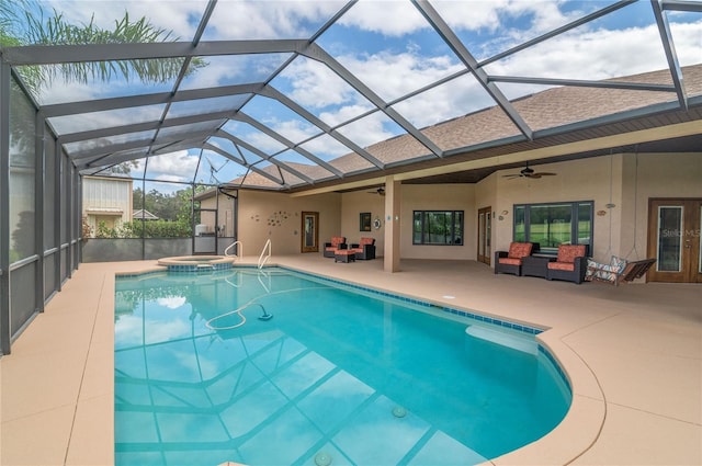 view of swimming pool with ceiling fan, a lanai, an outdoor hangout area, an in ground hot tub, and a patio