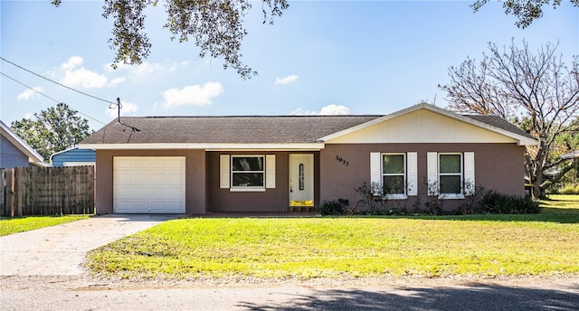 ranch-style home with a garage and a front lawn