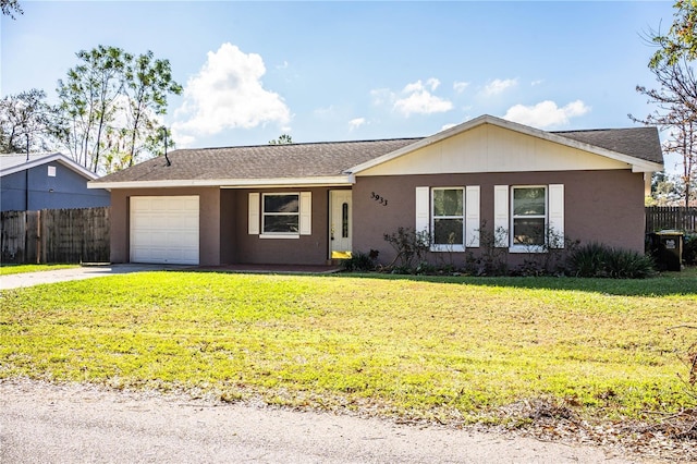 3933 Strickland Ct, Lakeland, FL 33812 - single story home featuring an attached garage, driveway, stucco siding, and a shingled roof