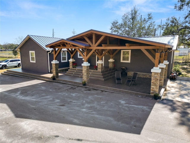 view of front of house featuring a patio