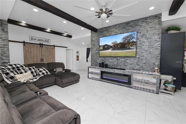 living room featuring beamed ceiling, a barn door, and ceiling fan