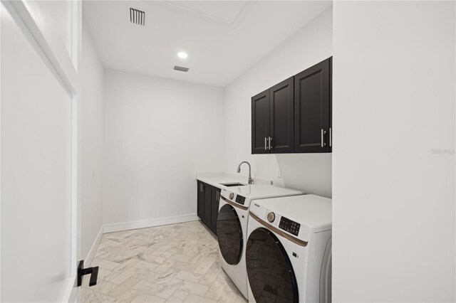 washroom featuring recessed lighting, a sink, cabinet space, independent washer and dryer, and visible vents