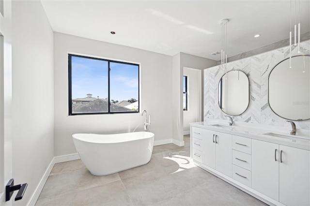 bathroom featuring vanity, a tub to relax in, and concrete floors