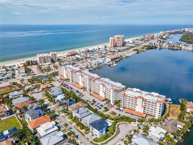 drone / aerial view featuring a view of city and a water view