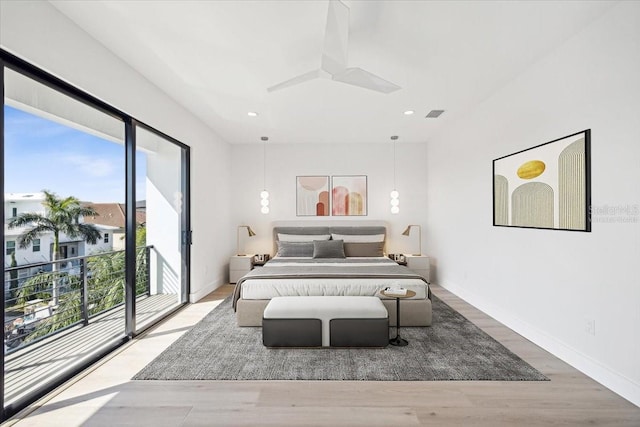 bedroom with hardwood / wood-style flooring, ceiling fan, and access to outside