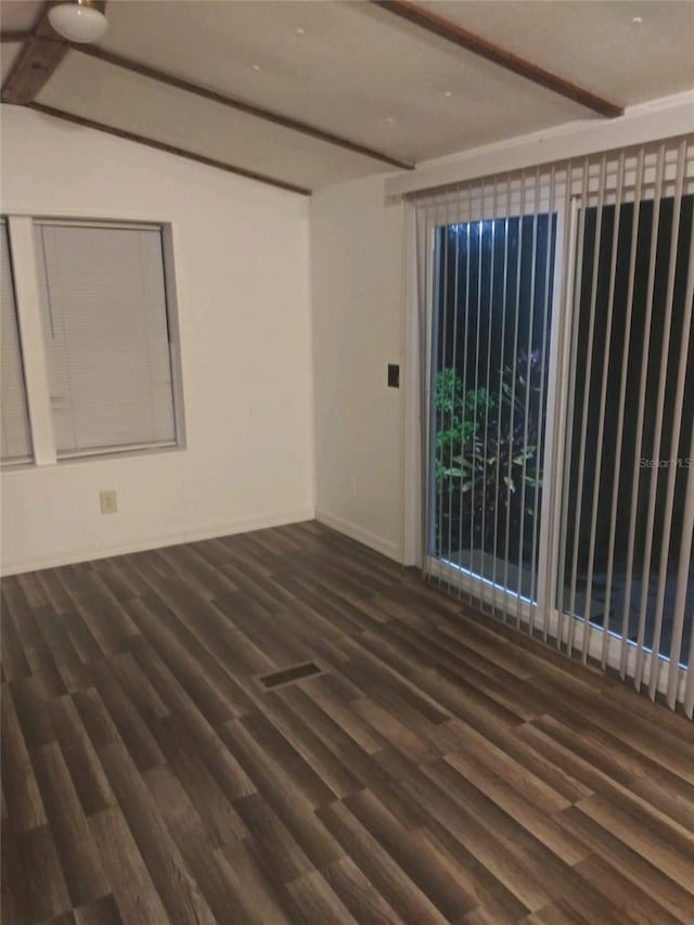 empty room with wood finished floors and baseboards