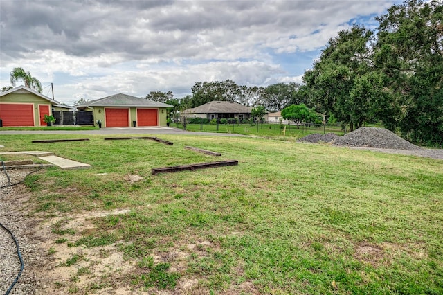 view of yard with an outdoor structure and a garage