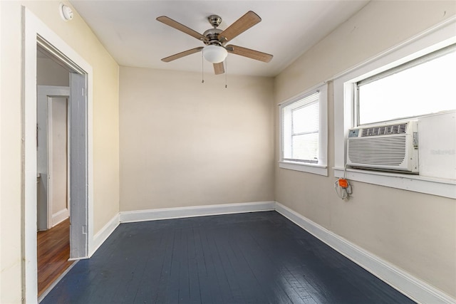 spare room with ceiling fan, cooling unit, and dark hardwood / wood-style flooring