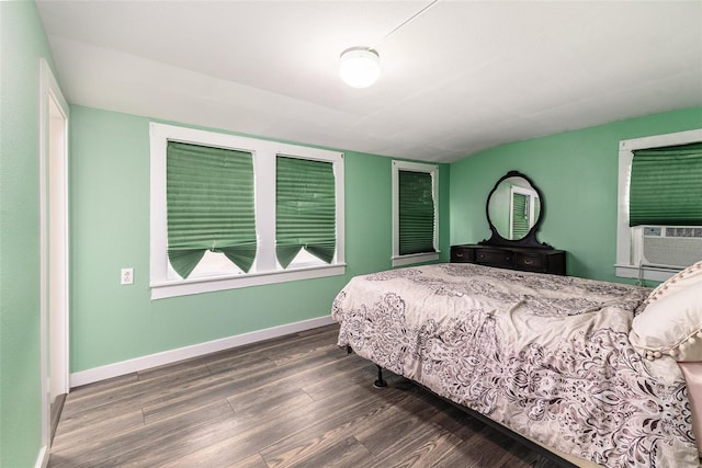 bedroom featuring cooling unit and dark hardwood / wood-style floors