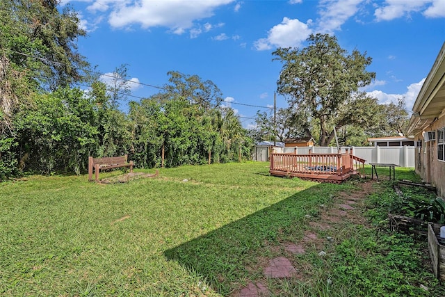 view of yard with a wooden deck