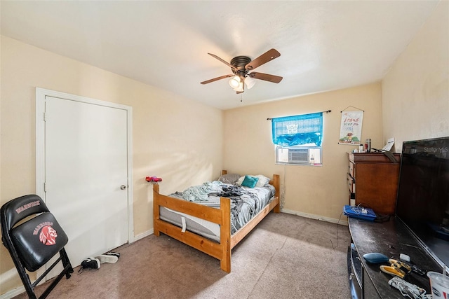 bedroom featuring cooling unit, light carpet, and ceiling fan