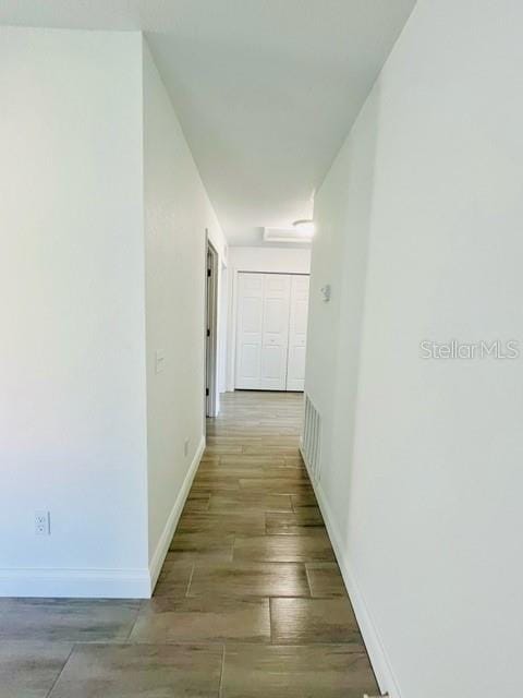 hallway with light hardwood / wood-style flooring