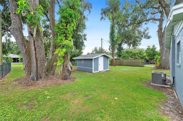 view of yard with a shed and central AC unit