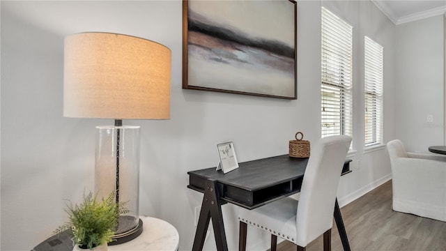 dining space with crown molding and wood-type flooring