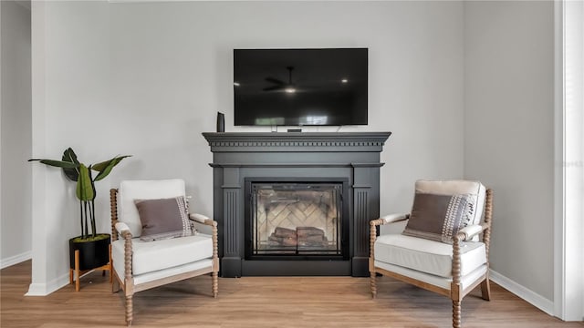 living area with wood-type flooring