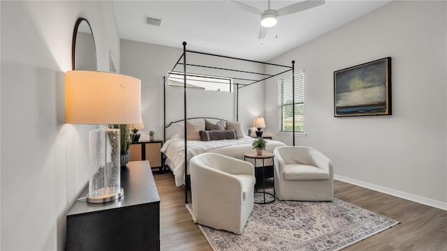 bedroom with hardwood / wood-style floors and ceiling fan