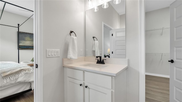 bathroom featuring vanity and hardwood / wood-style floors