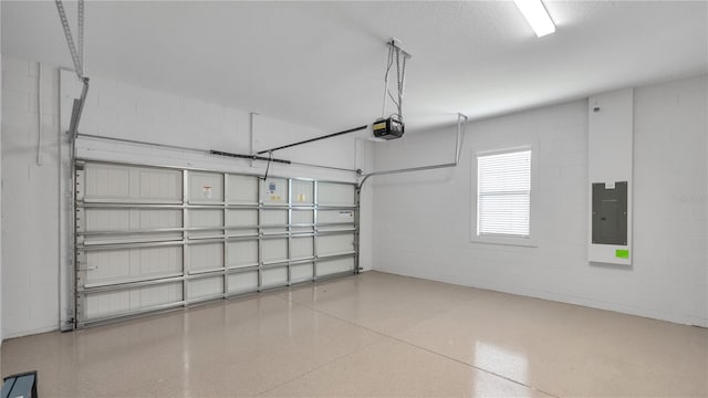 garage with a garage door opener and electric panel