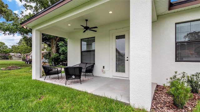 view of patio with outdoor lounge area and ceiling fan