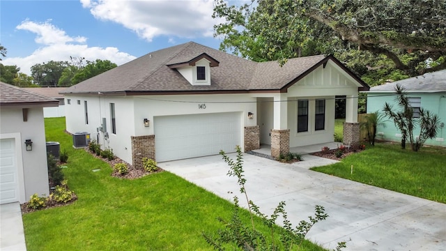 view of front of property with a garage, central AC, and a front lawn