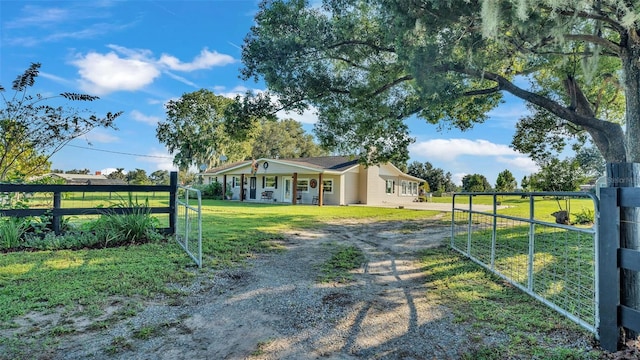 view of gate with a lawn and covered porch