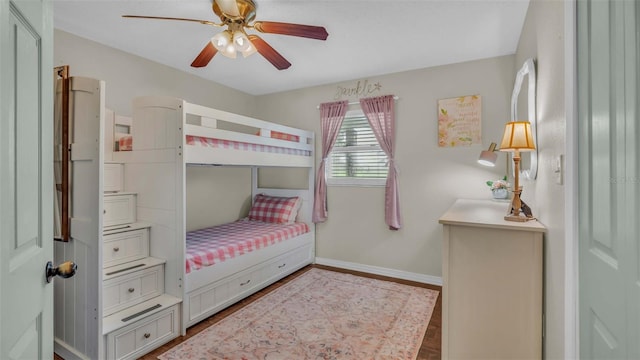 bedroom with ceiling fan and light hardwood / wood-style floors