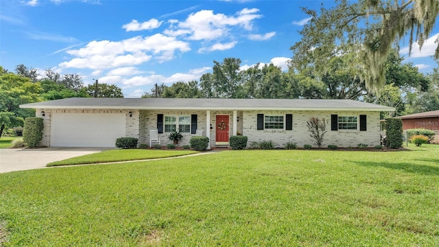 ranch-style house with a garage and a front yard