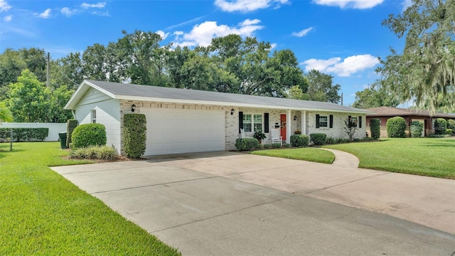 ranch-style house featuring a garage and a front lawn