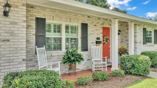 view of exterior entry with covered porch