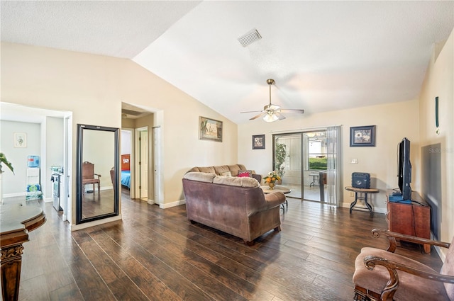 living room featuring ceiling fan, lofted ceiling, and dark hardwood / wood-style floors