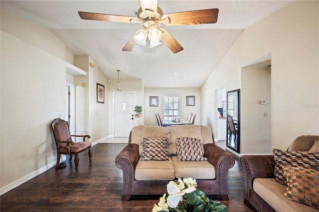 living room featuring dark wood-type flooring, ceiling fan, a textured ceiling, and lofted ceiling