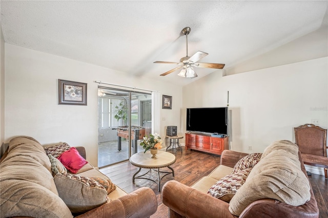 living room with lofted ceiling, hardwood / wood-style floors, and ceiling fan