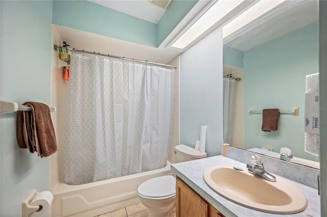 full bathroom with shower / tub combo, a skylight, toilet, tile patterned floors, and vanity