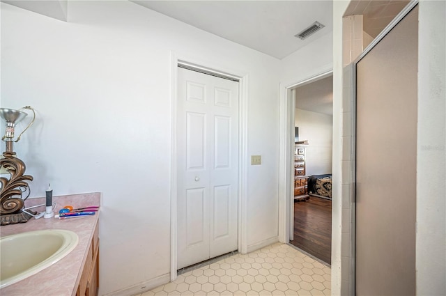 941 Devonshire Way, Lake Wales, FL 33853 - full bathroom with a stall shower, vanity, and baseboards