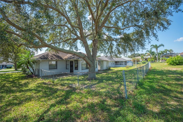 ranch-style house with a front yard