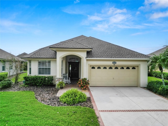 single story home with a front lawn and a garage