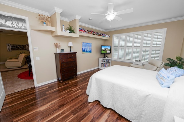 bedroom with dark wood-type flooring, ceiling fan, and crown molding