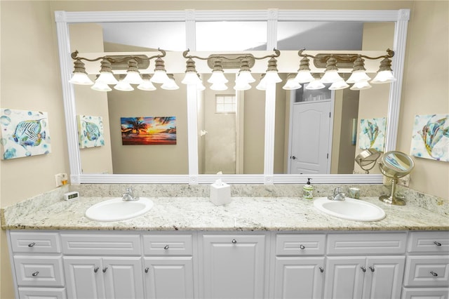 full bath with a sink and double vanity