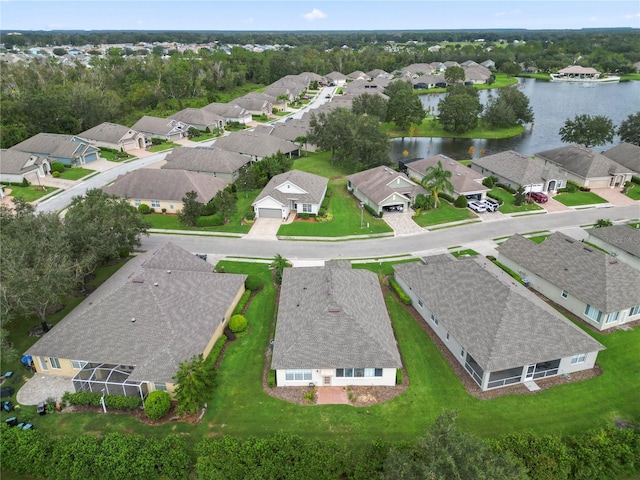 bird's eye view featuring a water view and a residential view