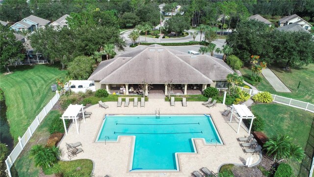 view of pool featuring a patio area and a lawn