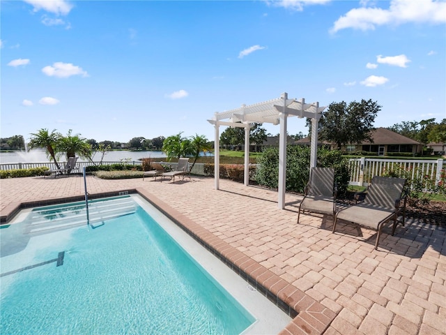 view of swimming pool featuring a patio, a water view, and a pergola