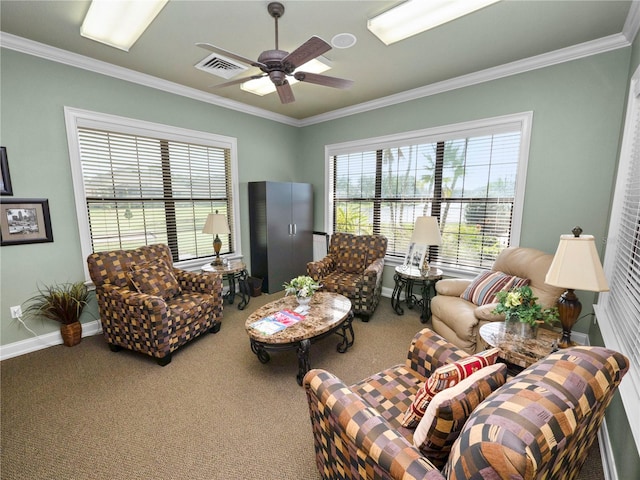 carpeted living room featuring ornamental molding and ceiling fan