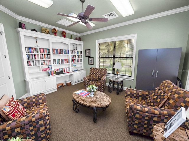 living area with crown molding, ceiling fan, and dark colored carpet