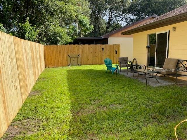 view of yard with a patio area