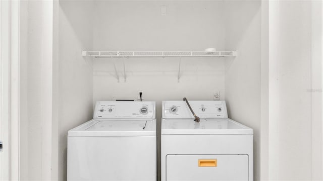 laundry area featuring laundry area and washer and clothes dryer