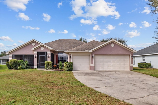 ranch-style house with a garage and a front lawn