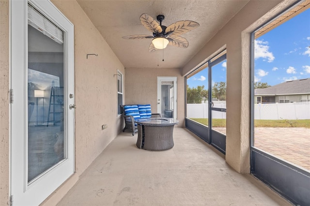 sunroom / solarium with ceiling fan