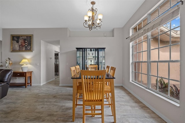 dining space featuring a notable chandelier